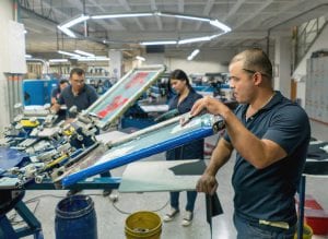 Man textile printing at a factory